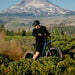 The man started the Kingbull Rover 2.0 electric bike in a jungle, and the bicycle raised the sand.