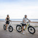 A man and a woman on the beach with their kingbull electric bike